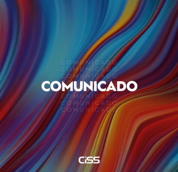 Plano de fundo com diversas cores e a palavra 'comunicado' centralizada escrita de branco